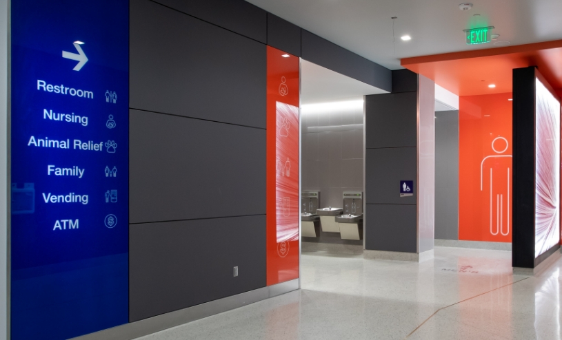 Directional signage at the airport pointing to restrooms, nursing, animal relief and other travel needs.