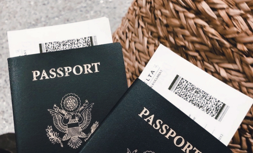 Two passports with passenger tickets sticking out of the top.